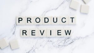 Scrabble tiles spelling 'Product Review' on a marble surface for conceptual illustration.